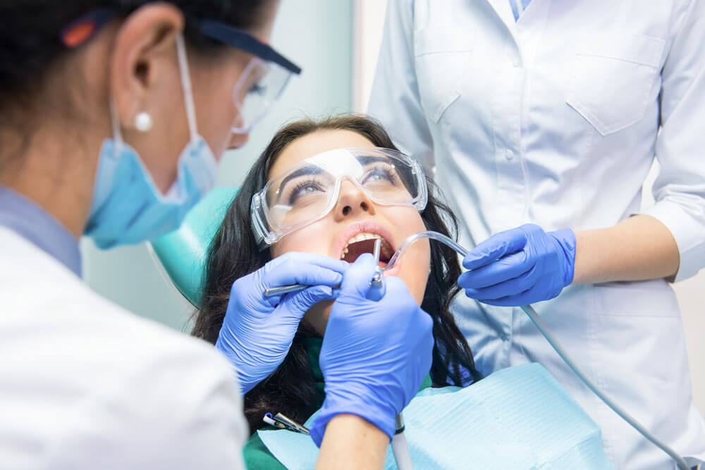 Patient in dental exam chair.