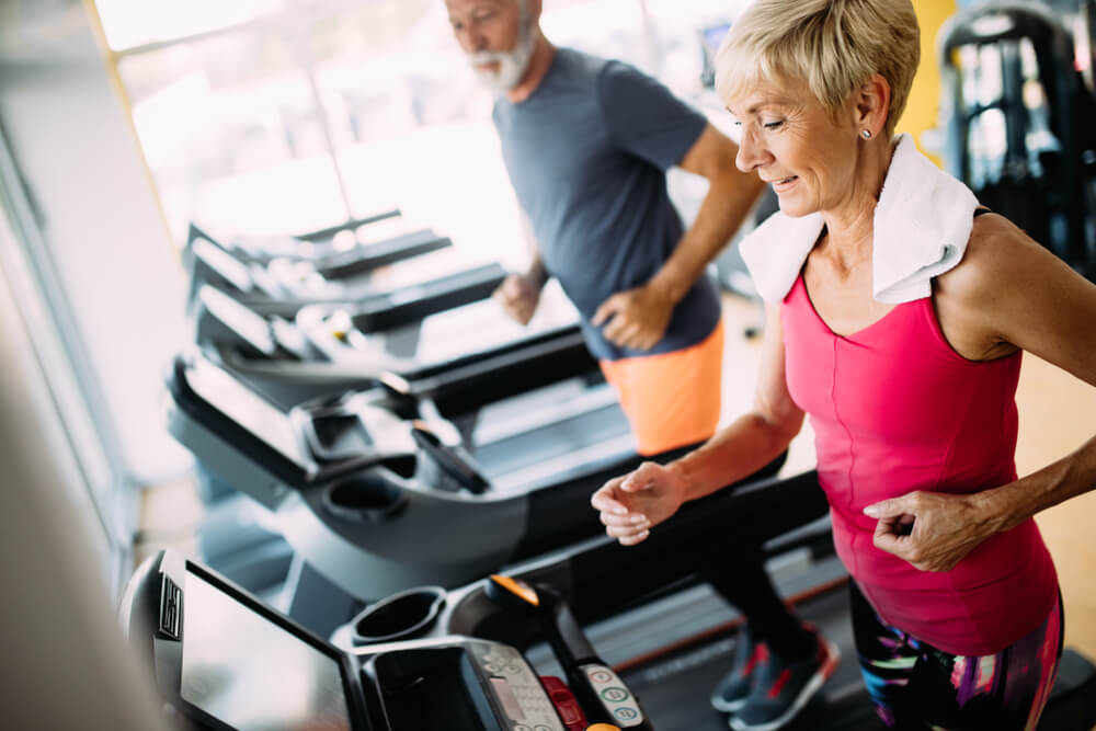 Mature couple on treadmills